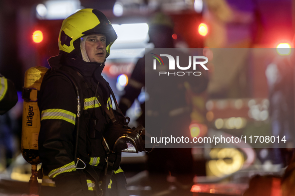 Emergency services fight a fire after a Russian drone hits a residential high-rise in Kyiv, Ukraine, on October 25, 2024. A 14-year-old girl...