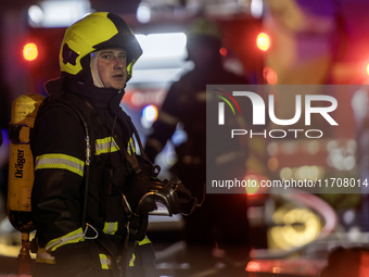 Emergency services fight a fire after a Russian drone hits a residential high-rise in Kyiv, Ukraine, on October 25, 2024. A 14-year-old girl...