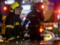 Emergency services fight a fire after a Russian drone hits a residential high-rise in Kyiv, Ukraine, on October 25, 2024. A 14-year-old girl...