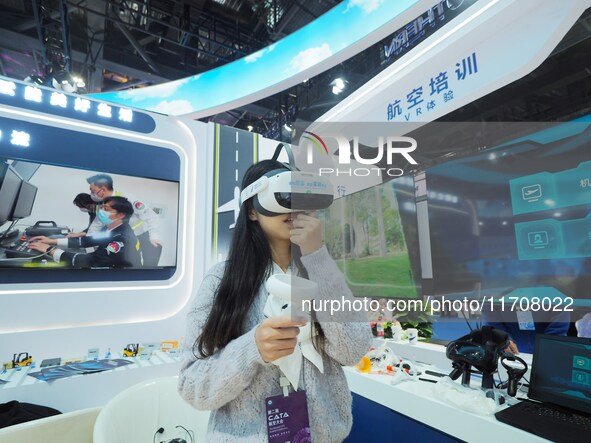 Visitors experience the ''VR Aviation Training System'' at the 2nd CATA Aviation Conference in Beijing, China, on October 26, 2024. 