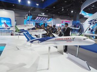 Viewers visit aircraft models at the 2nd CATA Aviation Conference in Beijing, China, on October 26, 2024. (