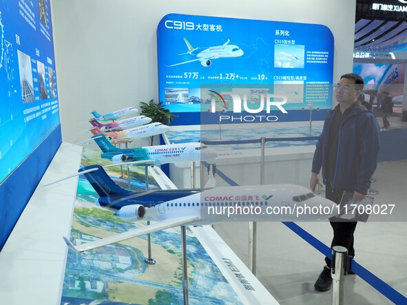 Viewers visit aircraft models at the 2nd CATA Aviation Conference in Beijing, China, on October 26, 2024. 