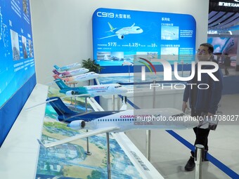 Viewers visit aircraft models at the 2nd CATA Aviation Conference in Beijing, China, on October 26, 2024. (