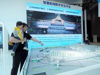 The audience visits the ''Smart Airport Digital Twin Platform Model'' at the 2nd CATA Aviation Conference in Beijing, China, on October 26,...