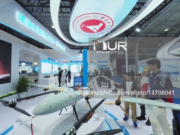 The audience visits the ''Composite Wing Drone'' at the 2nd CATA Aviation Conference in Beijing, China, on October 26, 2024. 