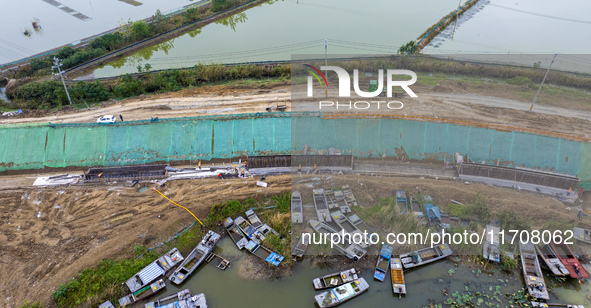 Workers work on the Hongze Lake water conservancy project in Suqian, Jiangsu province, China, on October 26, 2024. 