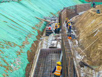 Workers work on the Hongze Lake water conservancy project in Suqian, Jiangsu province, China, on October 26, 2024. (