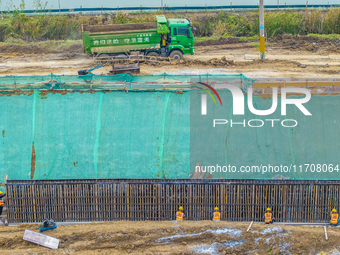 Workers work on the Hongze Lake water conservancy project in Suqian, Jiangsu province, China, on October 26, 2024. (