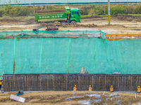 Workers work on the Hongze Lake water conservancy project in Suqian, Jiangsu province, China, on October 26, 2024. (