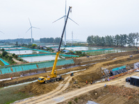 Workers work on the Hongze Lake water conservancy project in Suqian, Jiangsu province, China, on October 26, 2024. (