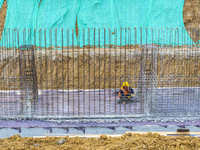 Workers work on the Hongze Lake water conservancy project in Suqian, Jiangsu province, China, on October 26, 2024. (