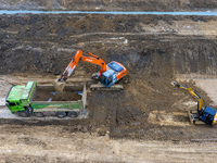 Workers work on the Hongze Lake water conservancy project in Suqian, Jiangsu province, China, on October 26, 2024. (