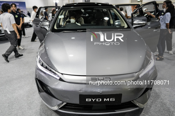 Visitors inspect a BYD M6 electric car at the Bangkok EV Expo 2024 in Bangkok, Thailand, on October 26, 2024. The Bangkok EV Expo 2024 is an...