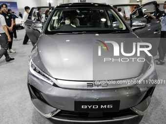 Visitors inspect a BYD M6 electric car at the Bangkok EV Expo 2024 in Bangkok, Thailand, on October 26, 2024. The Bangkok EV Expo 2024 is an...