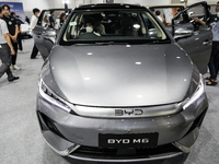 Visitors inspect a BYD M6 electric car at the Bangkok EV Expo 2024 in Bangkok, Thailand, on October 26, 2024. The Bangkok EV Expo 2024 is an...