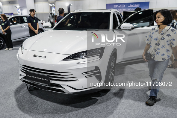 Visitors inspect a BYD SEALION 6 electric car at the Bangkok EV Expo 2024 in Bangkok, Thailand, on October 26, 2024. The Bangkok EV Expo 202...