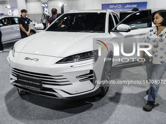 Visitors inspect a BYD SEALION 6 electric car at the Bangkok EV Expo 2024 in Bangkok, Thailand, on October 26, 2024. The Bangkok EV Expo 202...