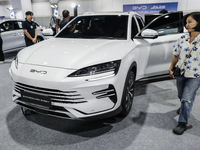 Visitors inspect a BYD SEALION 6 electric car at the Bangkok EV Expo 2024 in Bangkok, Thailand, on October 26, 2024. The Bangkok EV Expo 202...