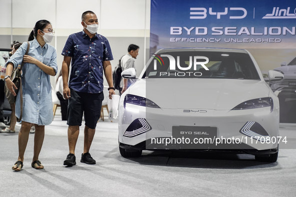 Visitors inspect a BYD SEAL electric car at the Bangkok EV Expo 2024 in Bangkok, Thailand, on October 26, 2024. The Bangkok EV Expo 2024 sho...