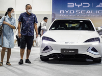 Visitors inspect a BYD SEAL electric car at the Bangkok EV Expo 2024 in Bangkok, Thailand, on October 26, 2024. The Bangkok EV Expo 2024 sho...