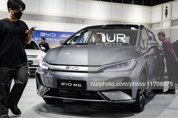 Visitors inspect a BYD M6 electric car at the Bangkok EV Expo 2024 in Bangkok, Thailand, on October 26, 2024. The Bangkok EV Expo 2024 is an...