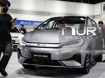 Visitors inspect a BYD M6 electric car at the Bangkok EV Expo 2024 in Bangkok, Thailand, on October 26, 2024. The Bangkok EV Expo 2024 is an...