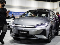 Visitors inspect a BYD M6 electric car at the Bangkok EV Expo 2024 in Bangkok, Thailand, on October 26, 2024. The Bangkok EV Expo 2024 is an...