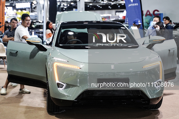 Visitors inspect a DEEPAL AVATR 11 electric car at the Bangkok EV Expo 2024 in Bangkok, Thailand, on October 26, 2024. The Bangkok EV Expo 2...