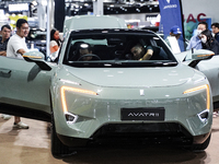 Visitors inspect a DEEPAL AVATR 11 electric car at the Bangkok EV Expo 2024 in Bangkok, Thailand, on October 26, 2024. The Bangkok EV Expo 2...