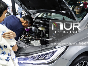 Visitors inspect a BYD M6 electric car at the Bangkok EV Expo 2024 in Bangkok, Thailand, on October 26, 2024. The Bangkok EV Expo 2024 is an...