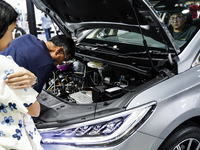 Visitors inspect a BYD M6 electric car at the Bangkok EV Expo 2024 in Bangkok, Thailand, on October 26, 2024. The Bangkok EV Expo 2024 is an...