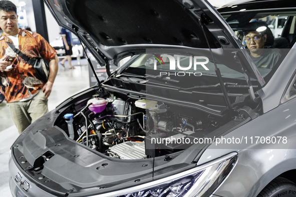 Visitors inspect a BYD M6 electric car at the Bangkok EV Expo 2024 in Bangkok, Thailand, on October 26, 2024. The Bangkok EV Expo 2024 is an...