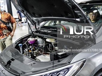 Visitors inspect a BYD M6 electric car at the Bangkok EV Expo 2024 in Bangkok, Thailand, on October 26, 2024. The Bangkok EV Expo 2024 is an...