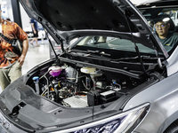 Visitors inspect a BYD M6 electric car at the Bangkok EV Expo 2024 in Bangkok, Thailand, on October 26, 2024. The Bangkok EV Expo 2024 is an...