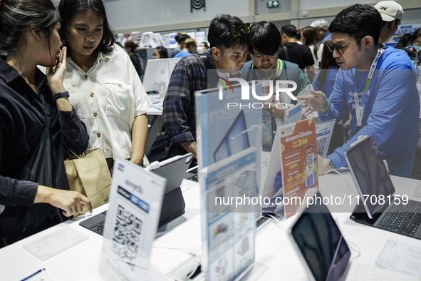 Visitors inspect the Apple iPad Air at the Thailand Mobile Expo 2024 in Bangkok, Thailand, on October 26, 2024. The expo showcases the newes...