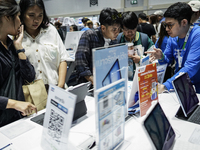 Visitors inspect the Apple iPad Air at the Thailand Mobile Expo 2024 in Bangkok, Thailand, on October 26, 2024. The expo showcases the newes...