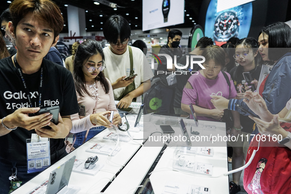 Visitors inspect Samsung smartphones at Thailand Mobile Expo 2024 in Bangkok, Thailand, on October 26, 2024. The expo showcases the newest s...