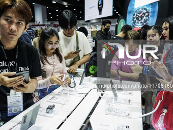 Visitors inspect Samsung smartphones at Thailand Mobile Expo 2024 in Bangkok, Thailand, on October 26, 2024. The expo showcases the newest s...