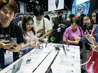 Visitors inspect Samsung smartphones at Thailand Mobile Expo 2024 in Bangkok, Thailand, on October 26, 2024. The expo showcases the newest s...