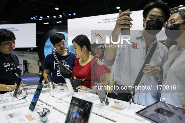 Visitors inspect Samsung smartphones at Thailand Mobile Expo 2024 in Bangkok, Thailand, on October 26, 2024. The expo showcases the newest s...