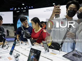 Visitors inspect Samsung smartphones at Thailand Mobile Expo 2024 in Bangkok, Thailand, on October 26, 2024. The expo showcases the newest s...