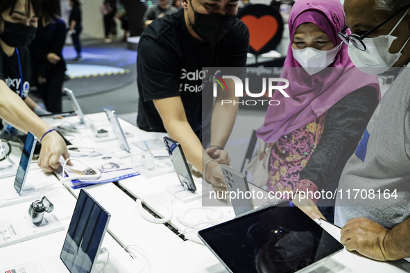 Visitors inspect Samsung smartphones at Thailand Mobile Expo 2024 in Bangkok, Thailand, on October 26, 2024. The expo showcases the newest s...