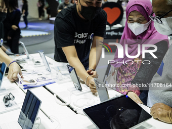 Visitors inspect Samsung smartphones at Thailand Mobile Expo 2024 in Bangkok, Thailand, on October 26, 2024. The expo showcases the newest s...