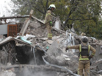 Rescuers work at the scene of an overnight Russian attack in the Novokadatskyi district of Dnipro, Ukraine, on October 25, 2024. NO USE RUSS...