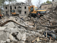 Rescuers work at the scene of an overnight Russian attack in the Novokadatskyi district of Dnipro, Ukraine, on October 25, 2024. NO USE RUSS...