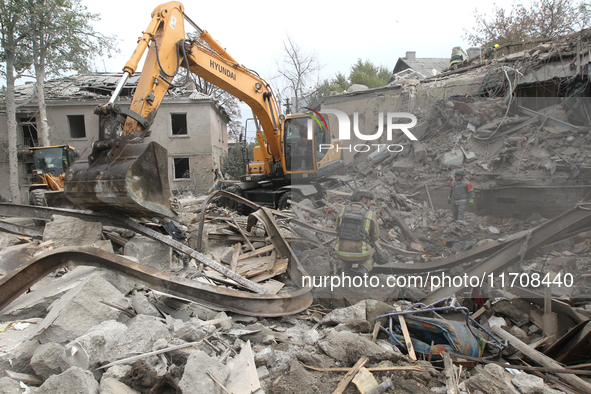 Rescuers work at the scene of an overnight Russian attack in the Novokadatskyi district of Dnipro, Ukraine, on October 25, 2024. NO USE RUSS...