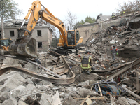 Rescuers work at the scene of an overnight Russian attack in the Novokadatskyi district of Dnipro, Ukraine, on October 25, 2024. NO USE RUSS...