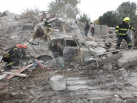 Rescuers work at the scene of an overnight Russian attack in the Novokadatskyi district of Dnipro, Ukraine, on October 25, 2024. NO USE RUSS...