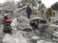 Rescuers work at the scene of an overnight Russian attack in the Novokadatskyi district of Dnipro, Ukraine, on October 25, 2024. NO USE RUSS...