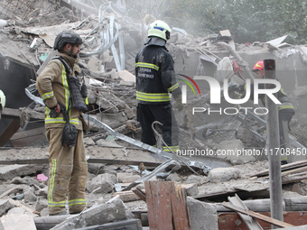 Rescuers work at the scene of an overnight Russian attack in the Novokadatskyi district of Dnipro, Ukraine, on October 25, 2024. NO USE RUSS...